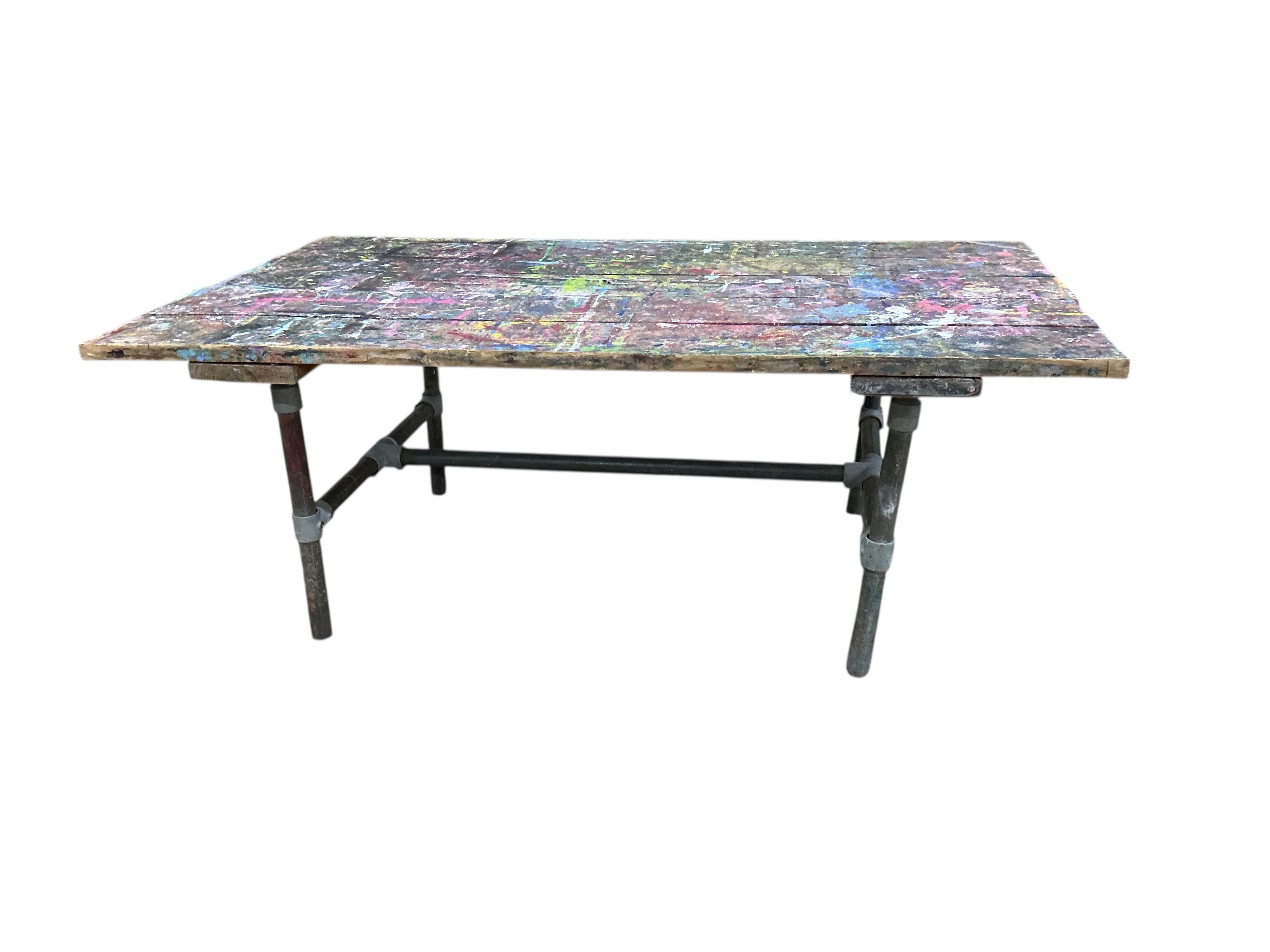 An industrial style rectangular artist's studio work table, width 195cm, depth 112cm, height 75cm
